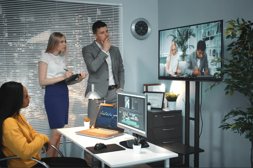 PEOPLE LOOKING AT VIDEO